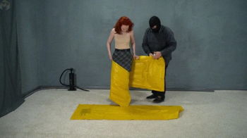 Inflatable mattress bondage in a transparent vacuum shell.webp