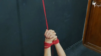 Tied Tight in Red- Helpless on the Chair, Ready to Be Worshipped.webp
