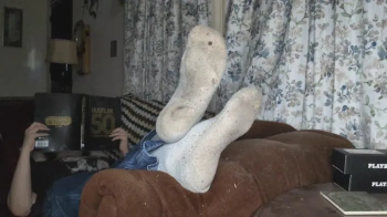 I Chill on the Living Room Couch with My Feet Propped up.webp