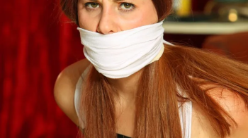 Defiant Lilian Tightly Taped Up, Panty Gagged, Massively Triple Gagged & Humiliated by her Stalker in- STALKED! RE EDIT.webp