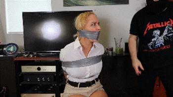 Anna Lee is an Interpol agent sent to Spain for a mission, but she's captured, tightly wraparound tape gagged and cruell.webp