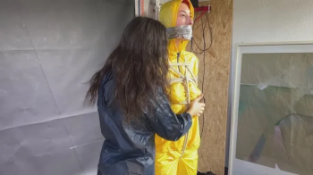 Aiyana and Myxxy enjoying each other in shiny nylon Rainwear (Both enjoyed it).webp