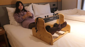 Cute Asian girl's beautiful feet are tickled.webp
