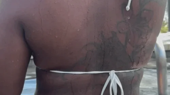 Ebony Giantess gets out of pool.webp