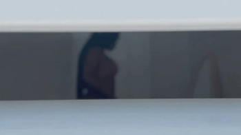 Unaware Ebony giantess being watched.webp