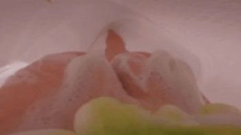 POV tiny man scrubs giantess body clean.webp