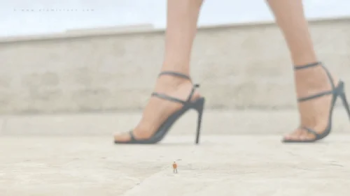 Giantess in black strappy heels and tiny speck.webp
