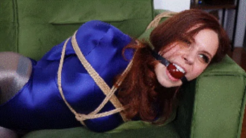 Mina Salome in shiny Amoresy bodysuit wants to be tightly tied up for an escape act, the ballgag was just to humiliate h.webp