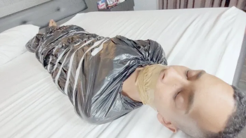 BABE AND BELLA CRUEL FARTING ON THE SLAVE TRAPPED IN PLASTIC WITH HIS MOUTH SEALED - CLIP FULL.webp