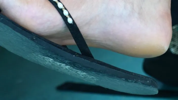 Candid flip flops dangling, strong feet, close-up foot fetish and hot bareheel soles.webp