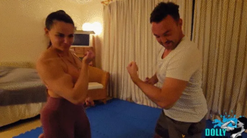 Wrestling and armwrestling _Dolly vs a tall man.webp