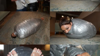 A thick duvet and duct tape mummification cocoon for rara curves (mp4).webp