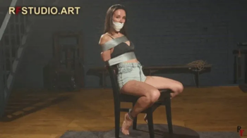 Sebastyana – Bound to Chair, Sock Gagged and Sealed with Microfoam Tape (FULL HD MP4).webp