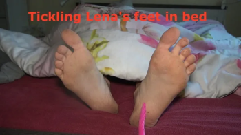 Tickling Lena feet in bed.webp
