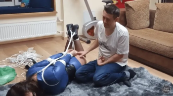 OLIVIA IN STORY OF O AND HER LITTLE SUBMISSIVE ADVENTURE - PART 2 - HOGTIED AND DISGRACED - Olivia Silver Hogtied, Ball.webp