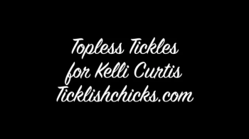 Kelli Curtis Topless, Tickled, Moaning and Tied Spread Eagle to Her Bed.webp