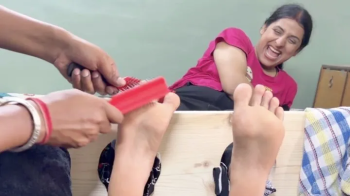 Professional Tickling Setup – Gorgeous Indian Soles Can’t Stop Laughing! - Beautiful Indian Feet in Wooden Stocks.webp