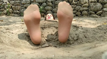 Buried in the sand Alicia with pantyhose and tickled feet (2).webp