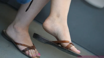 Foot fetish dangling admiration, slippers close-up, callous cute feet and soles ingnoring shoe fetish.webp