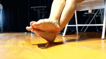 4K LELE crossed his feet and rubbed them together.webp
