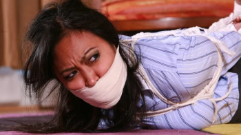 Veronica is a Powerful Crime boss who ends up getting Sock gagged, Toe-tied, TIGHTLY Hogtied & Toe-Tally Humiliated! RE.webp