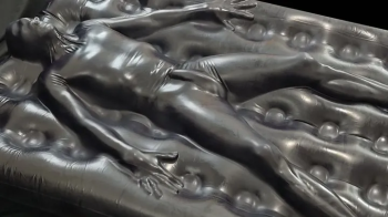 Trapped in the latex airbed vacuum bed.webp