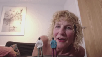 Giantess Molly finds and eats two tiny men.webp