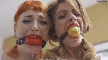 Secretaries Alba and Royal tightly ballgagged and bound, trying to escape.webp