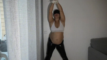 Tied slave with a big belly a.webp