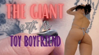 THE GIANT WITH HER TOY BOYFRIEND.webp