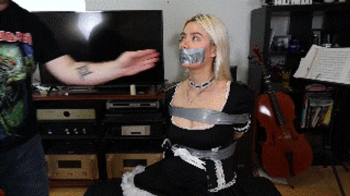 Angelica Coralvine the French maid of an eccentric rockstar gets tightly tied up and gagged as punishment for not cleani.webp