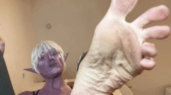 Drow Priestess giantess shrinks and stomps you makes you eat her toenails.webp