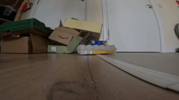 At My Feet- Giantess Crushing boxes.webp