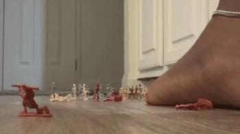 Giantess Goddess Leah and Her feet take on an army of betas.webp