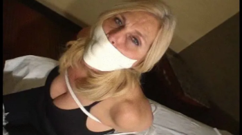 Big Boobed Barefoot Housewife Tied and Gagged.webp