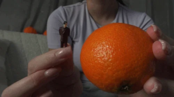 Giantess stepsister put tiny stepbrother in an orange then juggled with it like a ball and put the orange on tiny stepbr.webp