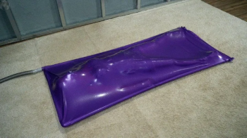 Sonya cums in a lilac vacuum bed with a medical mask on her face.webp