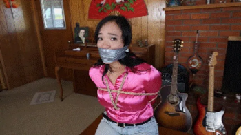 Raven Lynette cruelly wraparound tape gagged with mouth stuffed with her two socks and tightly tied up and hogtied, toes.webp
