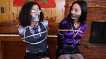 Sofia Caballero tries to rescue Khrystal but only to end up tied and gagged and humiliated during a bank robbery.webp