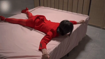 xr75-The girl's hands were tied to the bed.webp