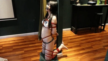 The barefoot girl in her restrictive underwear vibrated until she reached orgasm.webp