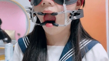 A beautiful and lovely Asian girl had her mouth stretched open and kept drooling.webp