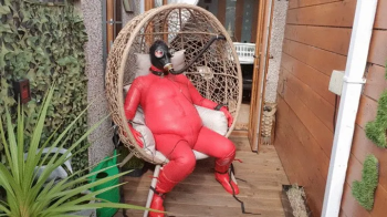 Outdoor Red Rubber Bondage.webp