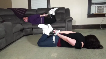 Hogtied and massively sock gagged.webp