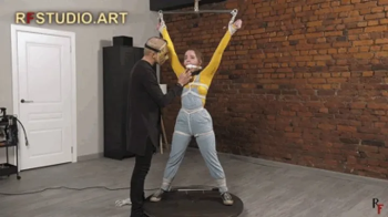 Rf Studio Production - Arina in X-Position Standing Bondage in Denim Overalls (UHD 4K MP4).webp