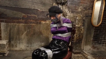MADE IN JAPAN 31- Detective Yui humiliated in tight tape bondage, stuffed mouth and gagged by her nemesis in a dark unde.webp